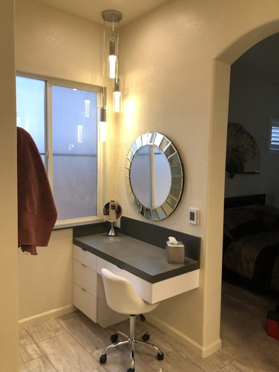 A bathroom with a sink and mirror in it