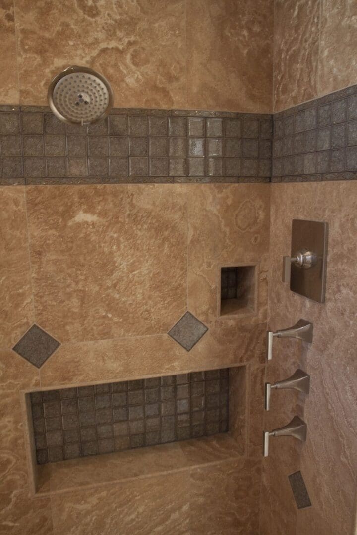 A bathroom with tiled walls and floors.